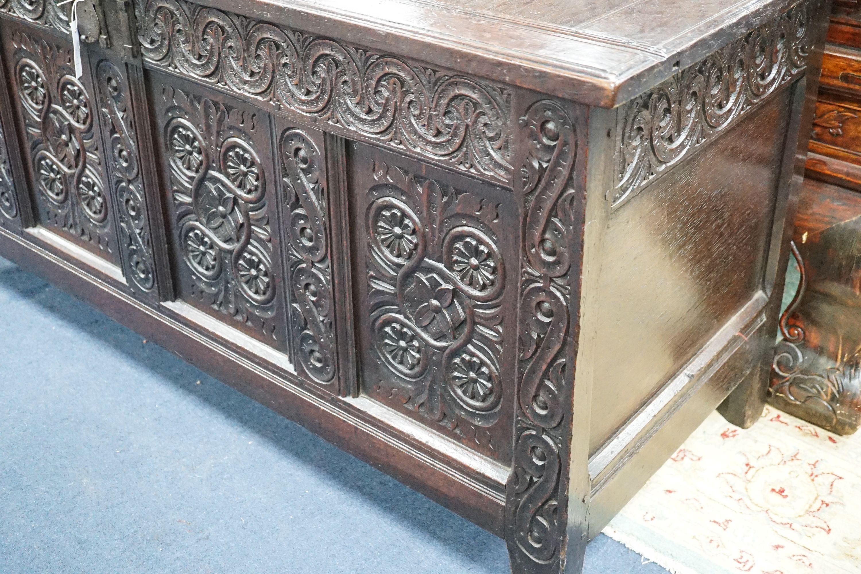 A 17th century Gloucestershire area carved, panelled oak coffer, length 150cm, depth 58cm, height 69cm